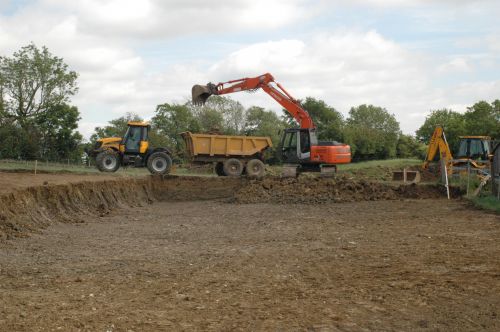 Click Here To Enlarge This Photo Of Excavators