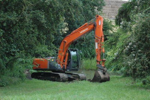 Click Here To Enlarge This Photo Of Excavators